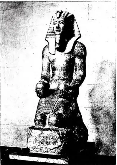 Left: GRANITE STATUE OF AMENHOTEP III (1410-1375 B.C.: 18th dynasty) - Turin, Museo d'antichità - Egyptian Section; Right: COMMEMORATIVE SCARAB OF AMENHOTEP III (1410-1375 B.C.: 18th dynasty). It commemorates the construction of an artificial lake for Queen Tiye. A notable detail is that the boat on