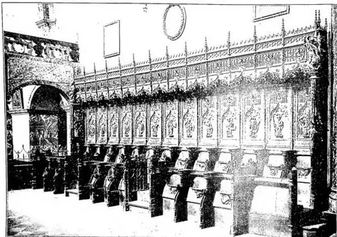 Carved wooden stalls (late 15th century - early 16th century). Choir of the collegiate church of Sts. Peter and Orso.