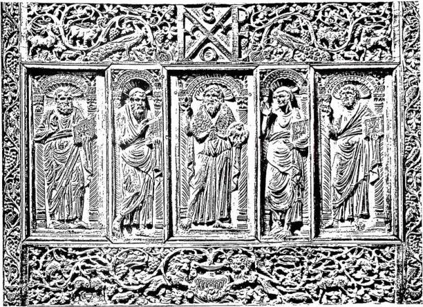 Above: DETAIL OF THE IVORY CHAIR OF MAXIMIAN (546-56). St. John the Baptist among the four Evangelists. - Above centre: monogram «Maximianus Episcopus». Ravenna, cathedral.