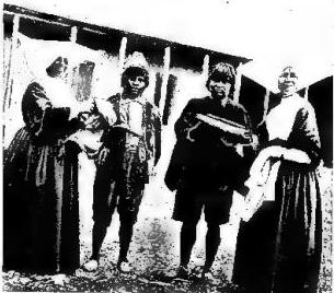 Right: TWO DAUGHTERS OF CHARITY with two Hindus.