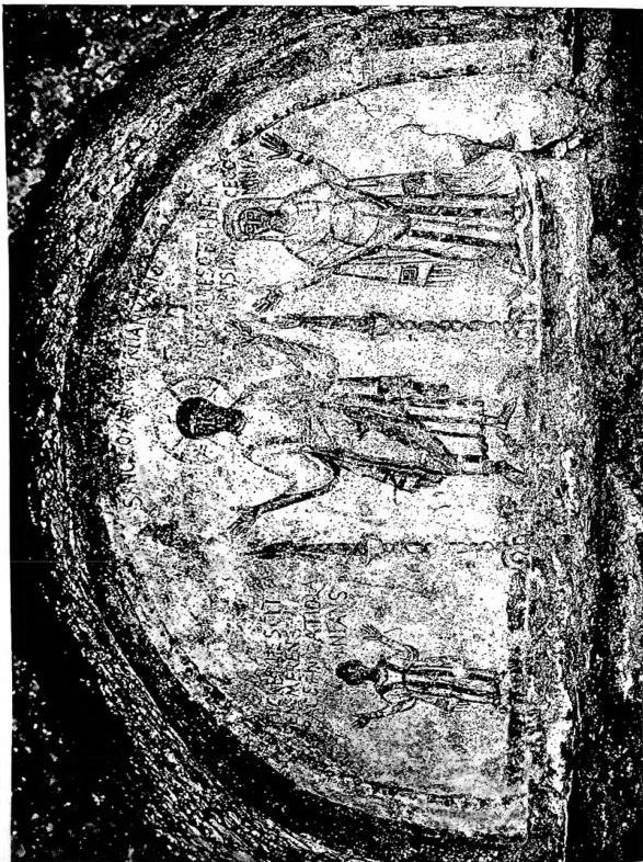 ST. JANUARIUS, martyr, in the attitude of an orant, between the deceased Nicatola, a girl, and Cominia. Fresco of the 5th cent. Naples, Catacombs of St. Januarius.