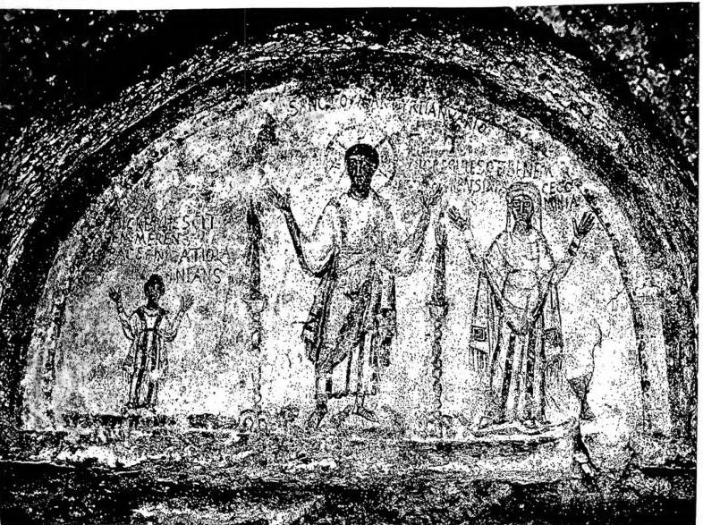 ST. JANUARIUS, martyr, in the attitude of an orant, between the deceased Nicatola, a girl, and Cominia. Fresco of the 5th cent. Naples, Catacombs of St. Januarius.