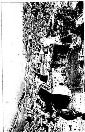 Above left: PANORAMA. Above right: VOMERO AND CASTEL S. ELMO FROM THE AIR. The castle is of 1340, transformed in 1540. Below left: ROYAL PALACE on a design by Domenico Fontana (1600-1602) modified by L. Vanvitelli and enlarged by Gaetano Genovese (1841). Façade towards the sea. Below right: MASCHIO ANGIOINO FROM THE AIR. Begun in 1280, enlarged in the 15th and 16th cent.