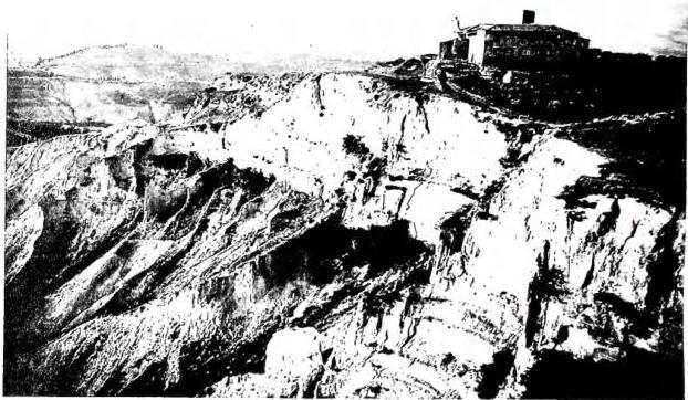 Above: VIEW OF THE BALZE. Above the abbey of SS. Salvatore, Giusto and Clemente, founded in the 11th cent., now abandoned - Volterra. Below left: THE ETRUSCAN ARCH. Rebuilt by the Romans, it preserves from the Etruscan era the jambs and the three heads - Volterra. Below right: PALAZZO DEI PRIORI (1208-57). In the lower part glazed terracotta plaques with coats of arms of the Florentine commissioners; the upper part of the Tower was executed after the earthquake of 1846 - Volterra.
